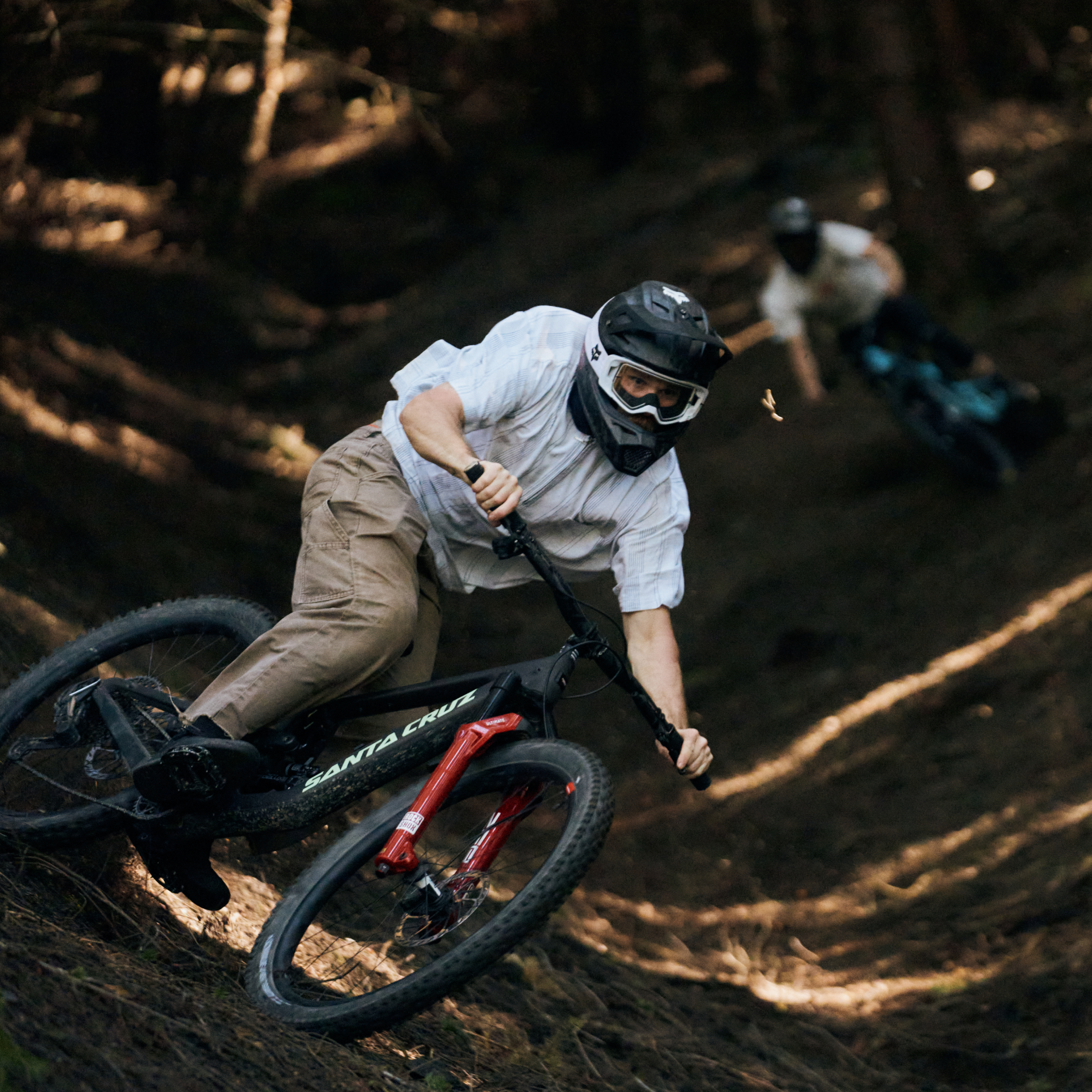 Person riding a mountain bike on a trail in a forest